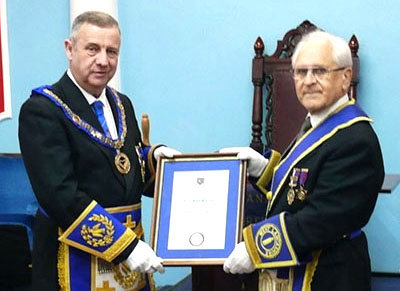 Peter Lockett (left) and David with the celebratory certificate. Peter Lockett (left) and David with the celebratory certificate.