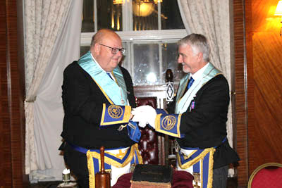 Colin thanks William for his help in installing him as master. Colin thanks William for his help in installing him as master.