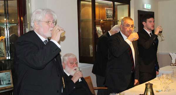 Toast to the health of the new master, led by David Hawkes (left). Toast to the health of the new master, led by David Hawkes (left).