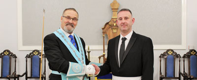 Leo Kap (left) congratulates Neil Roberts. Leo Kap (left) congratulates Neil Roberts.