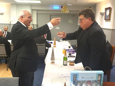 John Darrell (left) toasts new master John Hall with the Master’s Song. John Darrell (left) toasts new master John Hall with the Master’s Song.