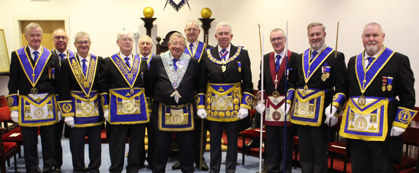 Mark and David (centre) with grand officers and team members.