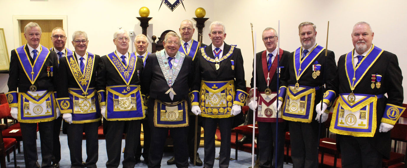 Mark and David (centre) with grand officers and team members. Mark and David (centre) with grand officers and team members.