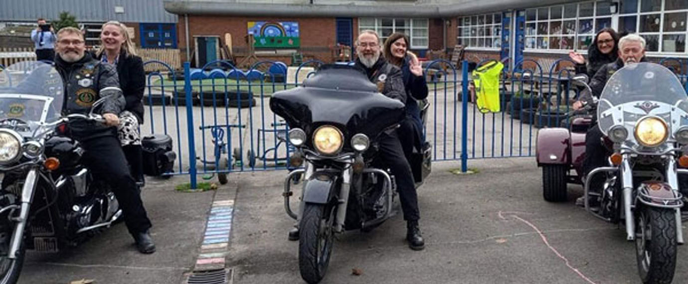 Pictured from left to right, are Leo Kap, Andy Baxendale and Mal Kid with members of staff on their bikes. Pictured from left to right, are Leo Kap, Andy Baxendale and Mal Kid with members of staff on their bikes.