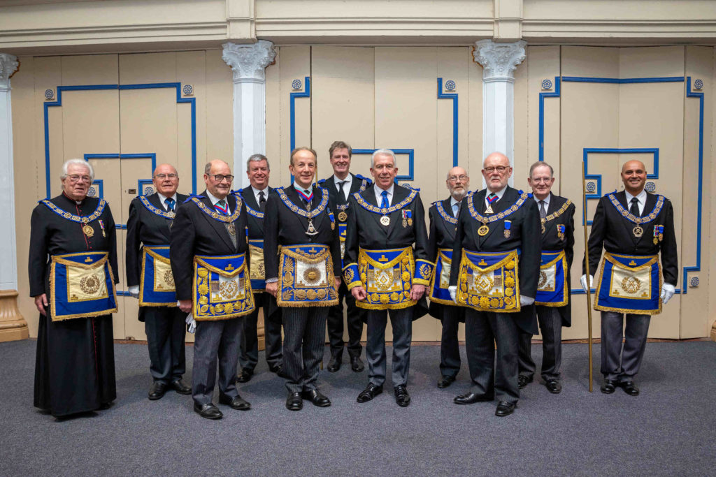 Mark Matthews (centre) surrounded by the team from UGLE