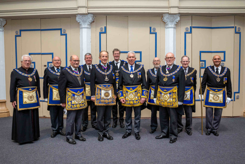 Mark Matthews (centre) surrounded by the team from UGLE Mark Matthews (centre) surrounded by the team from UGLE