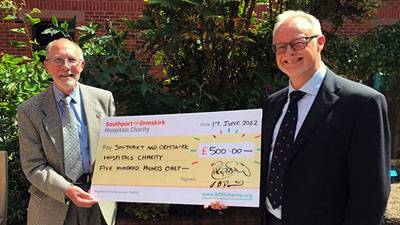 Cliff Davies (right) and Phil Stock displaying the ‘big cheque’. Cliff Davies (right) and Phil Stock displaying the ‘big cheque’.