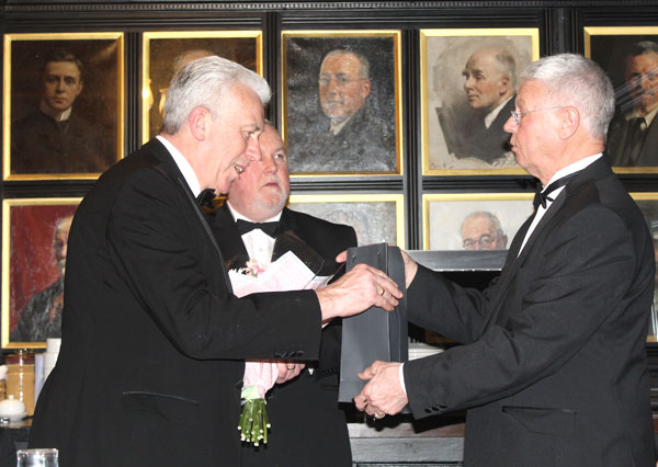 Andrew Thompson (right) presents Mark Matthews with gifts as director of ceremonies Steve Kayne looks on Andrew Thompson (right) presents Mark Matthews with gifts as director of ceremonies Steve Kayne looks on