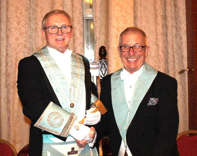 Roy Williams (left) being congratulated by immediate past master Jim Murphy. Roy Williams (left) being congratulated by immediate past master Jim Murphy.