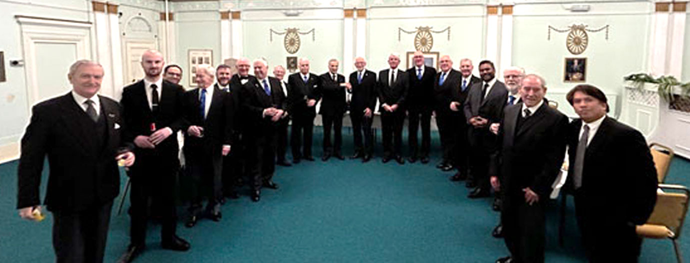 John Buckingham (centre) is congratulated by John James in the midst of Merchants’ Lodge brethren John Buckingham (centre) is congratulated by John James in the midst of Merchants’ Lodge brethren