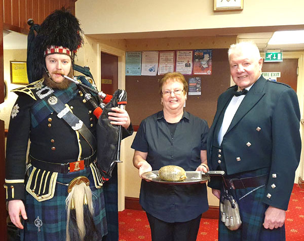 Pictured from left to right, are: Rowan Bos, Janet Myers and John Farrell ready to pipe the sacrificial haggis in. Pictured from left to right, are: Rowan Bos, Janet Myers and John Farrell ready to pipe the sacrificial haggis in.