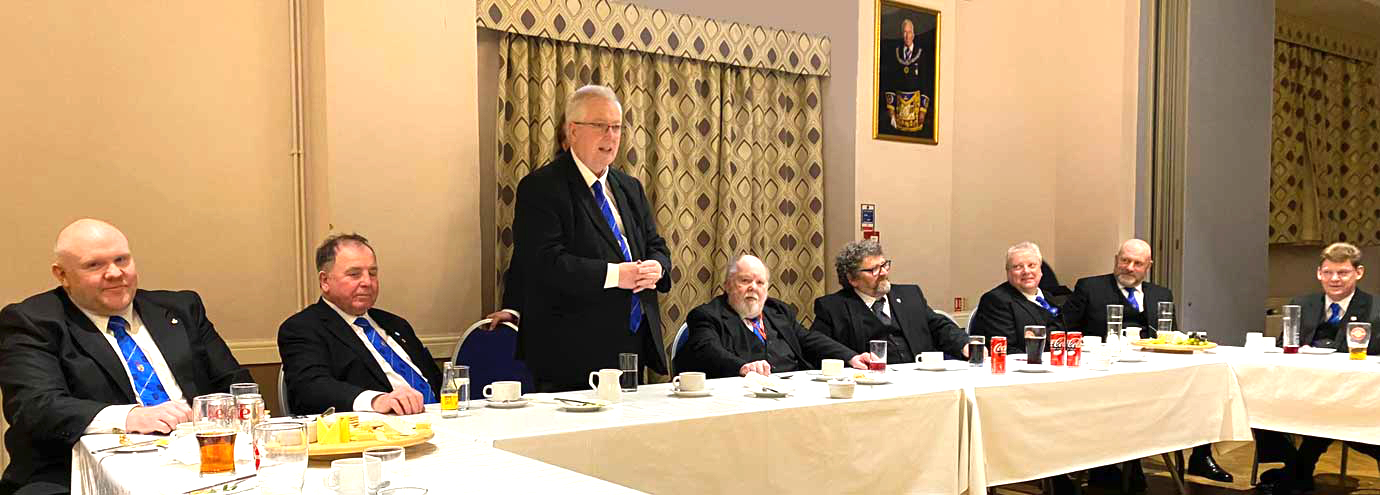John at the festive board congratulating Iain on being installed in the chair for the fifth time. John at the festive board congratulating Iain on being installed in the chair for the fifth time.
