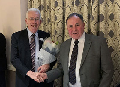 Graham Chambers presenting flowers to Mark Mathews. Graham Chambers presenting flowers to Mark Mathews.