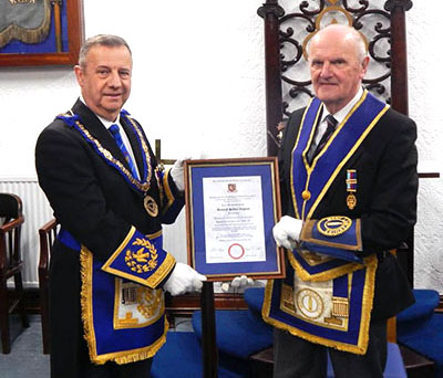 Peter Lockett (left) presents Ken Ingham with his certificate.