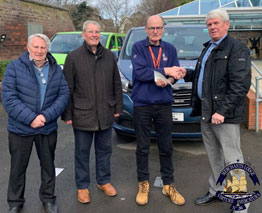 Charitable giving is not confined to their annual installation for Merchants’ Lodge No 241, the oldest lodge meeting in Liverpool. It is ongoing for many and Barry Marsden, master of Merchants’ Lodge along with other members of the lodge, Frank Daniels and Glyn Pine, went along to present John Wilson, the CEO of the Liverpool Seafarers Centre (LSC) with a cheque for £250. There are two members of Merchants’ Lodge who are involved with the Liverpool Seafarers Centre, they are Jhun Ranario who is a full-time employee of the LSC and Frank Daniels who supports the LSC on a part time basis. Why the Seafarers Centre? That is easily answered, Merchants’ Lodge has been operating continuously since the issue of its warrant in 1780, then meeting at The Golden Lion, Dale Street. Merchants’ Lodge, and its long history, reveals that past brethren of the lodge were engaged in commerce and shipping within the City of Liverpool for many years, and the present brethren felt that by supporting the LSC over the last few years that this link has been continued. Imagine being at sea for many weeks without sight of land, at the mercy of the elements and the increasing risk of pirate attack and having no contact with your loved ones. And when you reach port, 1000s of miles away from home, you have no guaranteed ticket home. That’s what a seafarer can go through on a merchant vessel to bring you the fuel for your car, almost everything you can see around you in your home and the food that you eat. LSC offers welfare services, advice, practical help, care and friendship, communication, transport, recreation, and financial aid when necessary. So next time you switch on the TV, give your child a teddy bear to play with, or just make a simple cup of tea, remember who brought it to you. At the centre, or aboard ship, LSC chaplains are always ready to provide advice and assistance, irrespective of a person’s beliefs or nationality. The LSC delivers a front-line service offering support to 50,000 seafarers passing through the Port of Liverpool each year. LSC’s mission remains firmly focused on providing a lifeline to seafarers, both active and retired, offering a safe and secure place to rest and receive practical and emotional support. It is thanks to the members of Merchants’ Lodge, along with other generous donors, that Liverpool is viewed by many sailors as a safe, secure and welcoming. The Merchants’ Lodge crest displays a sailing ship with the Latin motto, ‘Virture Mercatura’ which means ‘virtue in trading’.