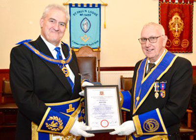David Clews (right) receives his certificate from Andrew Whittle.