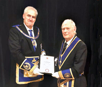 Andrew Whittle (left) presenting the certificate to Graham Platt.