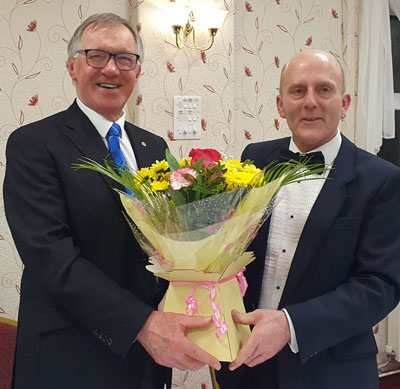 Darren Varley (right) presents John Robbie Porter with flowers. Darren Varley (right) presents John Robbie Porter with flowers.