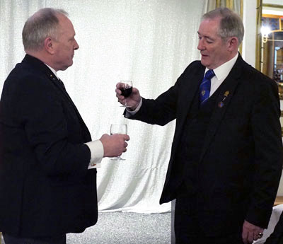 Peter Baldwin (right) toasts Mark Smith during the master’s song.