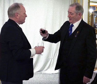 Peter Baldwin (right) toasts Mark Smith during the master’s song. Peter Baldwin (right) toasts Mark Smith during the master’s song.