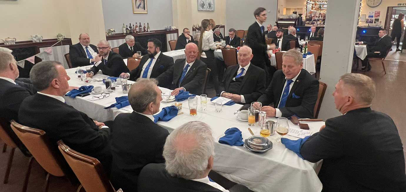 All the brethren and gentlemen enjoying themselves at the festive board. All the brethren and gentlemen enjoying themselves at the festive board.
