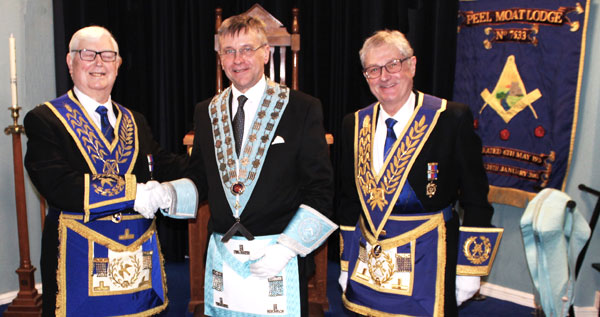Pictured from left to right, are: Brian Hayes congratulating Philip Lowe with Gareth Jones. Pictured from left to right, are: Brian Hayes congratulating Philip Lowe with Gareth Jones.