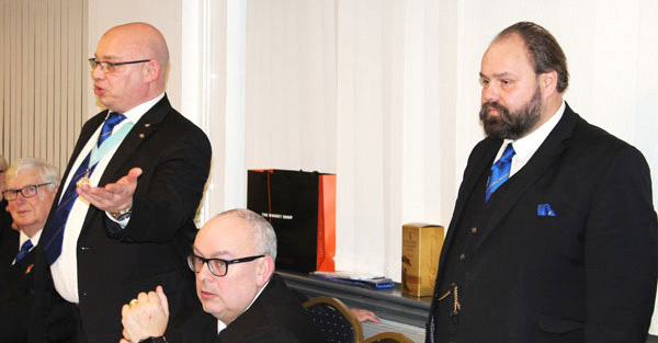WM Darren Gregory (left) congratulating Ezra (right) and lodge members for superb initiation ceremony.