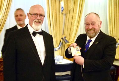 Peter Maxwell (right) receives the lodge past master’s jewel from Gerard Maxwell