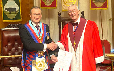Ian presents anniversary certificate to David. Ian presents anniversary certificate to David.