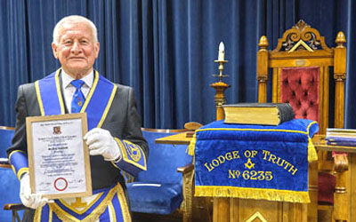 Geoffrey Caulfield happily showing his 50 years’ service certificate. 