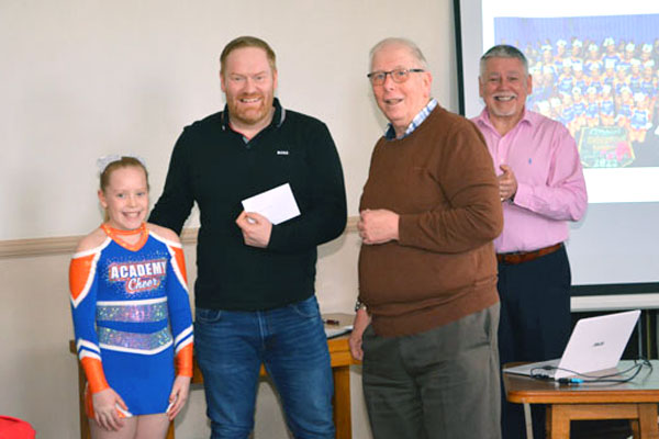Pictured from left to right, are: Piper Smith, Ben Smith, Alan Patterson presenting the cheque and Bob Williams.