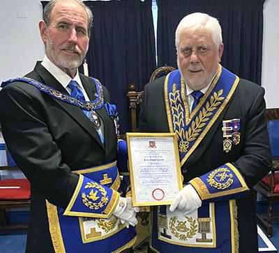 Frank Umbers presenting Brian with his certificate of 50 years in Freemasonry. Frank Umbers presenting Brian with his certificate of 50 years in Freemasonry.