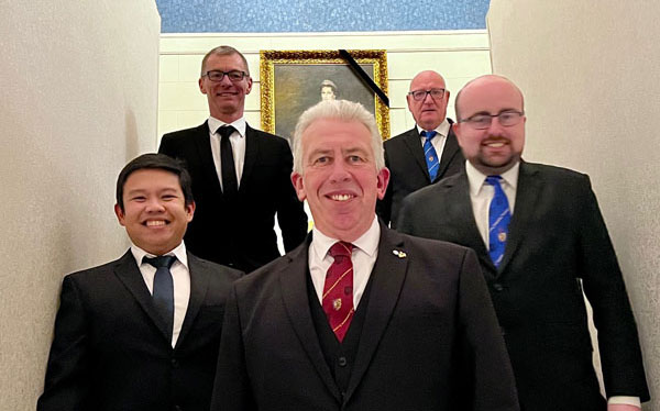 Mark Matthews (centre) with master Masons. Mark Matthews (centre) with master Masons.