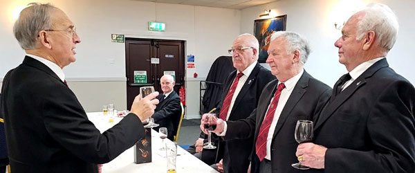 David Harrison (left) delivers the song to the three principals David Harrison (left) delivers the song to the three principals