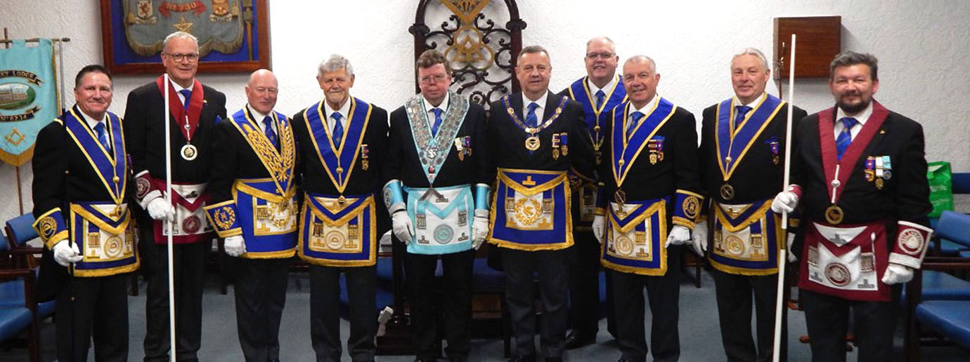 Peter Dean with Peter Lockett, grand officer, group officials, acting Provincial grand officers and the WM. 
