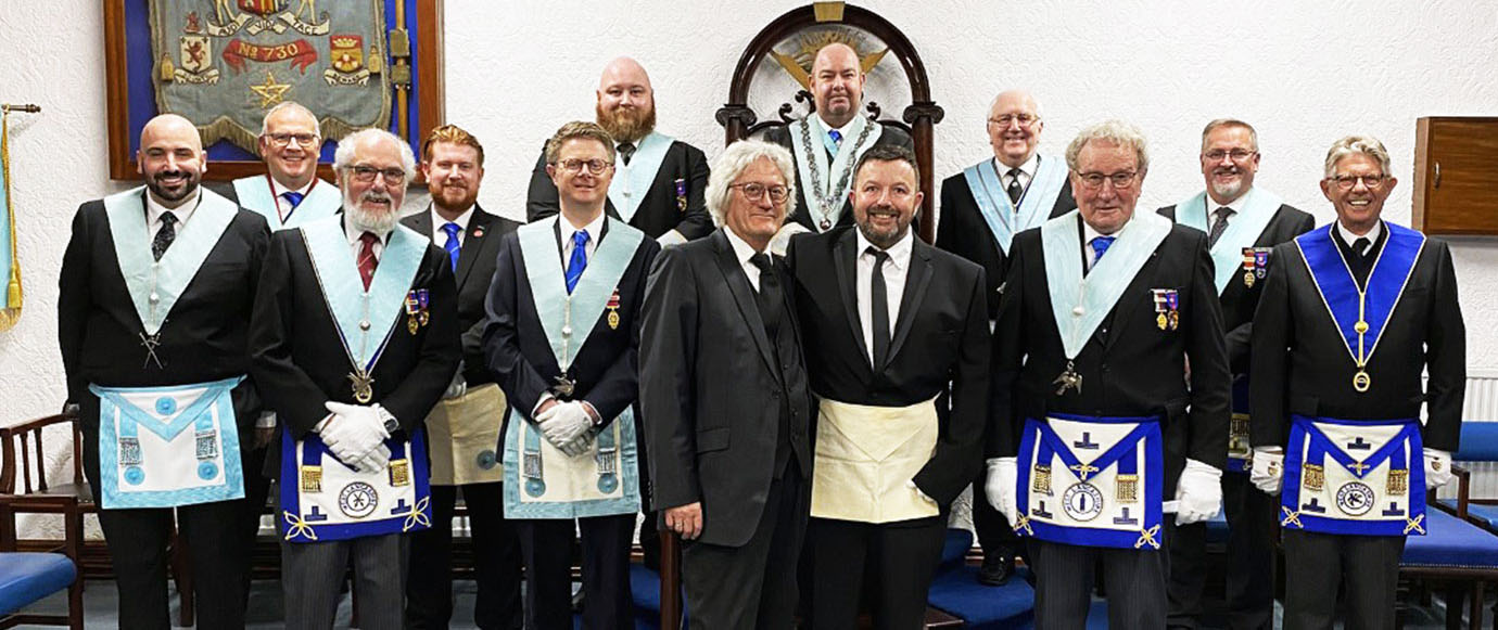 Members of White Hills Lodge with their WM and new members.