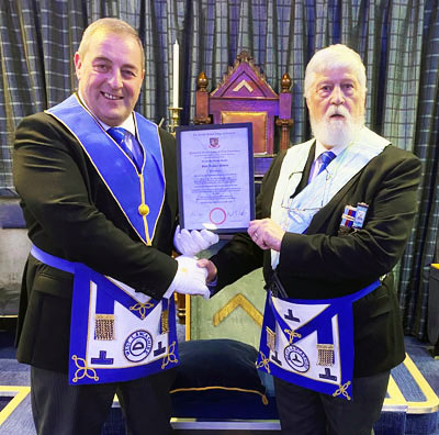 Scott Devine (left) presenting Glyn Davies with his certificate. Scott Devine (left) presenting Glyn Davies with his certificate.