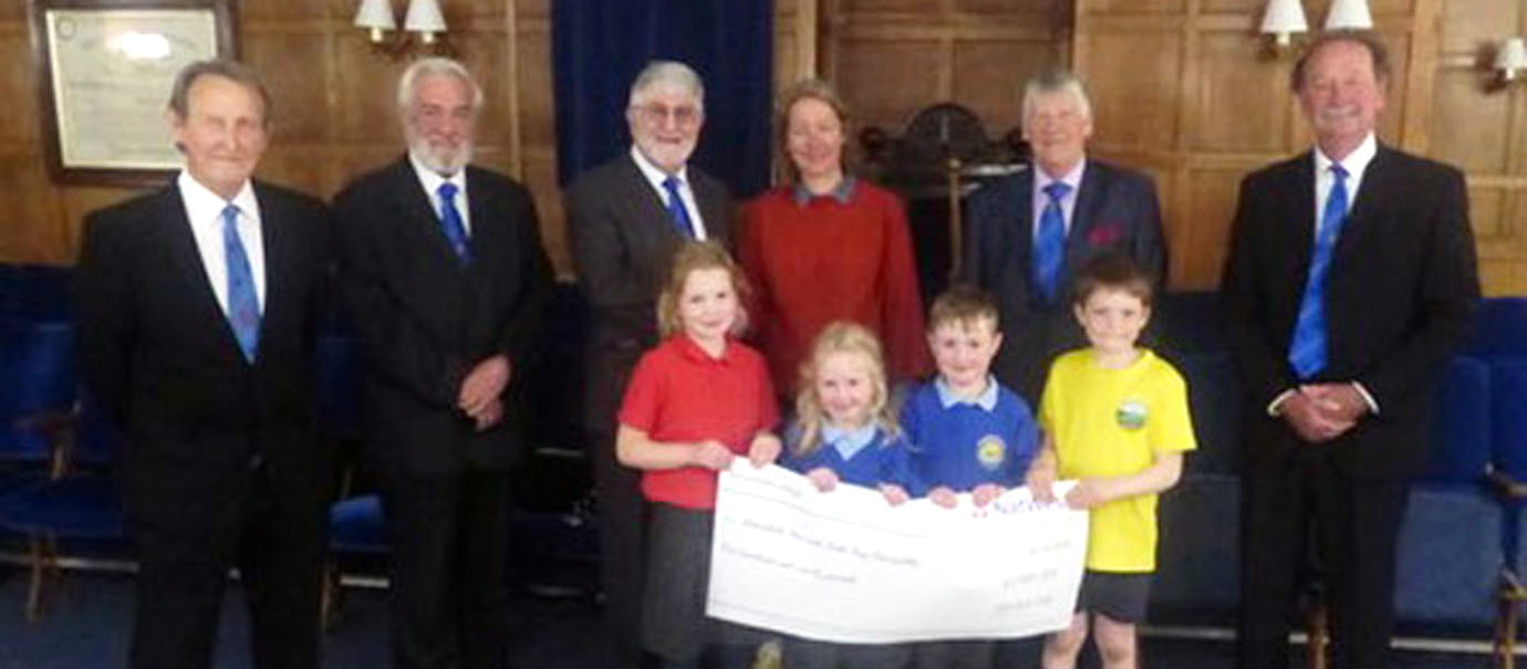 Pictured from left to right, are: Alec Dobson, John Gunson, John Robson, Helen Lloyd, Steve Fox and Tony Bland with Elsie, Molly, Lewis and Tom in front.