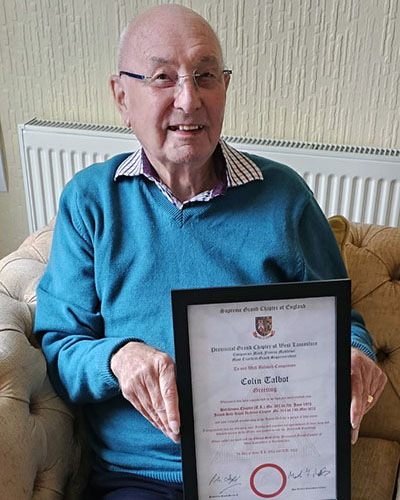 Colin at home proudly holding his framed certificate from the Grand Superintendent Mark Matthews Colin at home proudly holding his framed certificate from the Grand Superintendent Mark Matthews