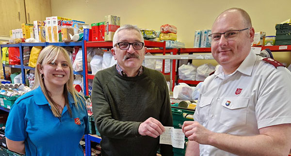 Pictured from left to right, are: Claire Bowerman, John Rimmer and Dominic Eaton in the storeroom at the Foodbank.