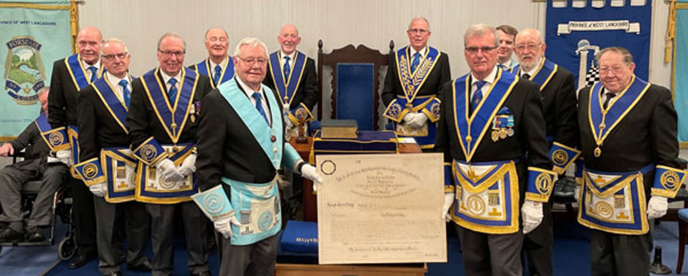 WM Frank Jones (front left) hands back the warrant to Wigan Group Chairman John Selley.