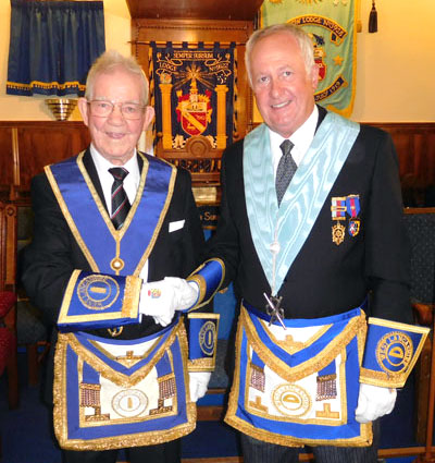 Jack Fawcett (left) is congratulated on his diamond jubilee in Freemasonry by his son Dean. 