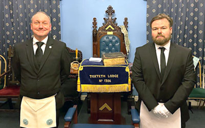 Joe Lynch (right) and David Beckett get ready for the ceremony.