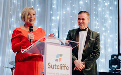 Fiona Murphy MBE and Sean Keyes, giving the opening speech.