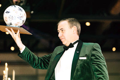 Sean auctions off the footballs. Sean auctions off the footballs.