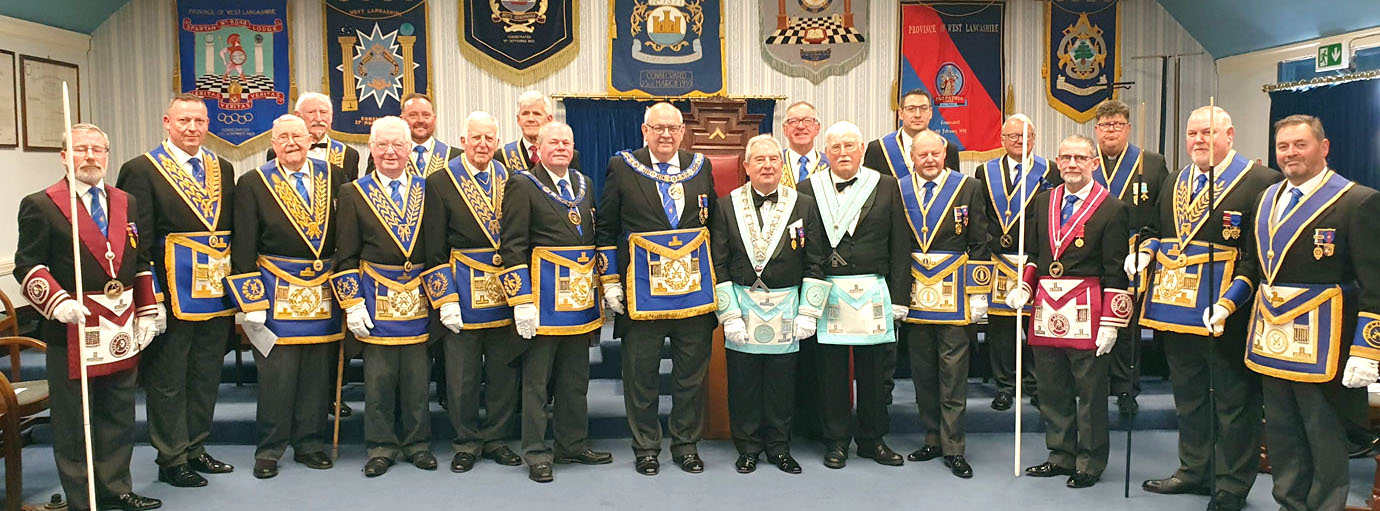 Philp Gunning and Martin Poole (centre), surrounded by grand and acting Provincial grand officers.