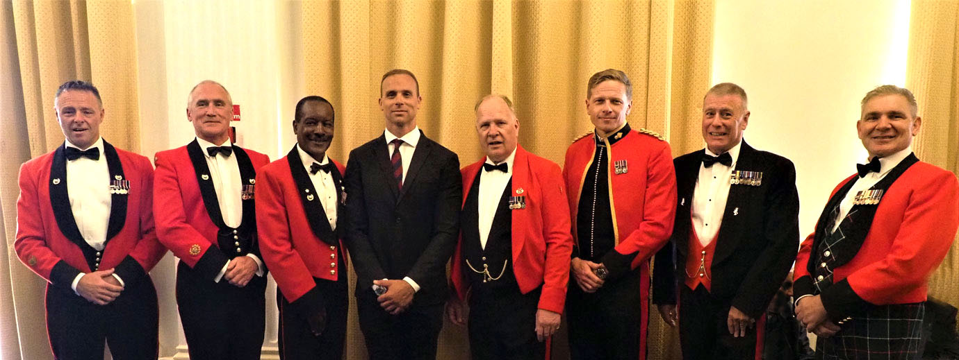 Paul Minter (left of centre) with Mark Smith (centre) and other uniformed diners.