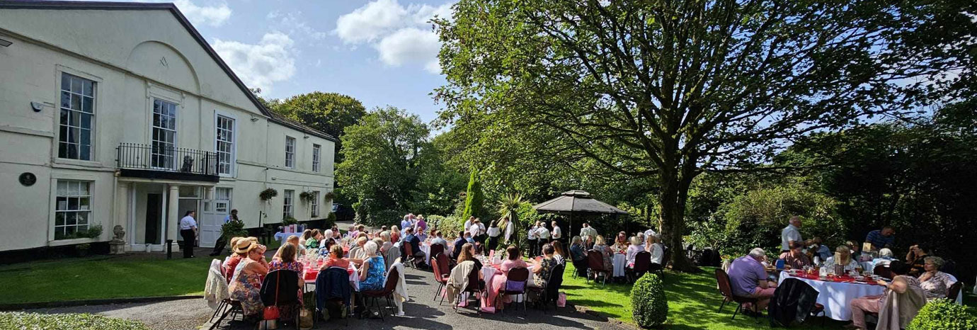 Everyone enjoying their afternoon tea, drinks and scones.