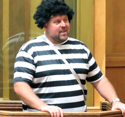 Chris stood in the dock pleading his innocence while wearing a stolen wig.