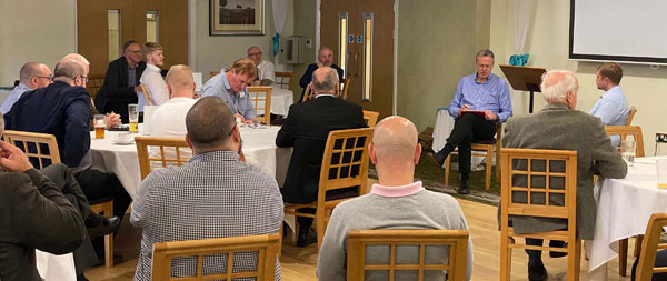 Nigel Monks (facing the audience left) interviewing Liam Carson (on Nigel’s left). Nigel Monks (facing the audience left) interviewing Liam Carson (on Nigel’s left).
